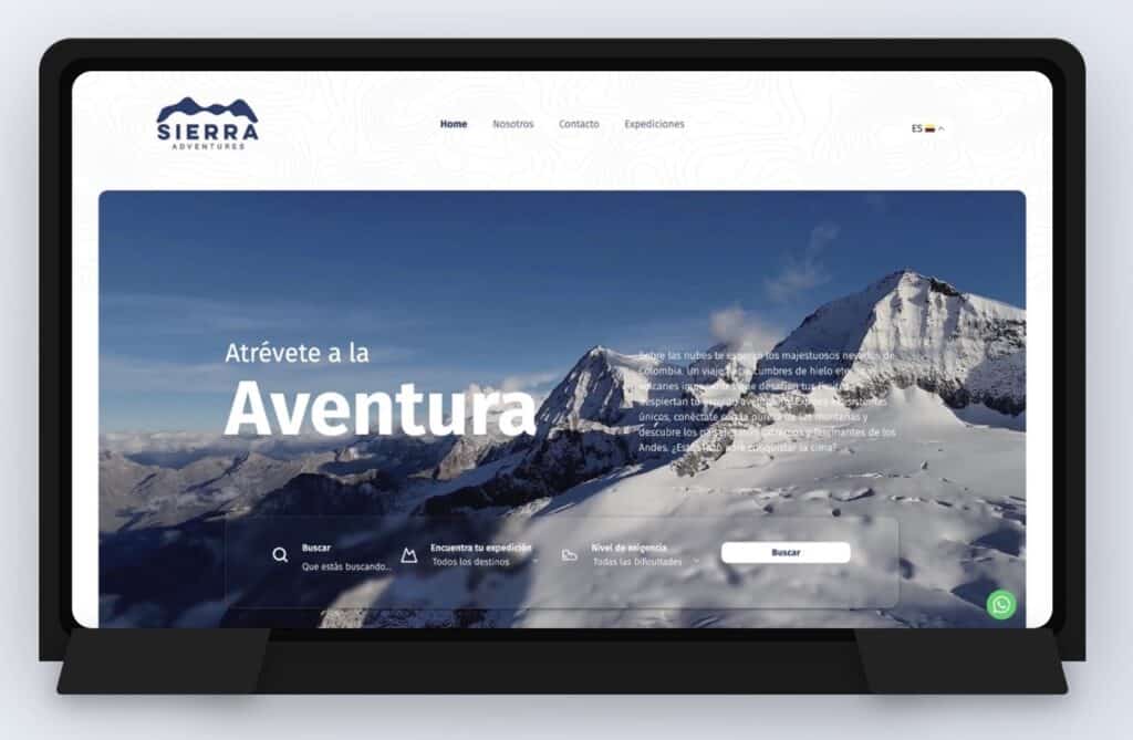 Página web de Sierra Adventure con montañas nevadas en fondo.